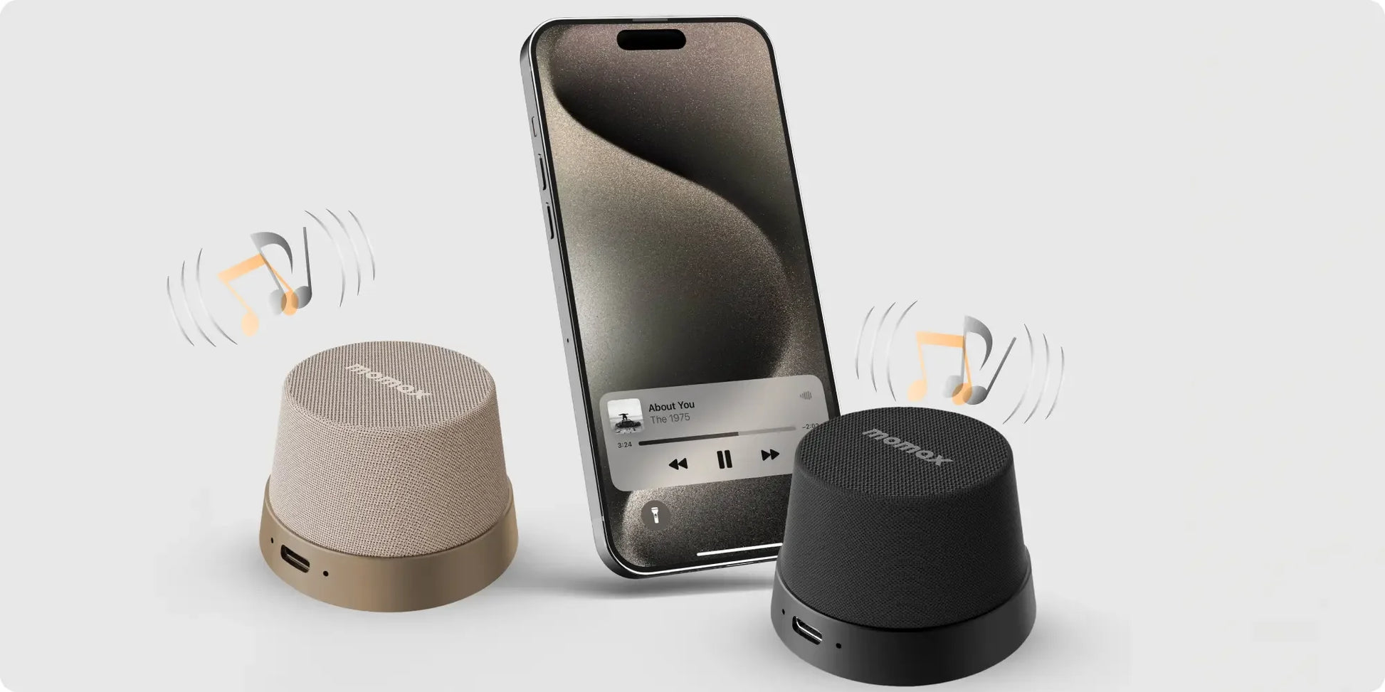 Tech stop MOMAX 1-Vibe Go magnetic wireless speaker and phone stand showing waterproof design with a sleek, modern look.