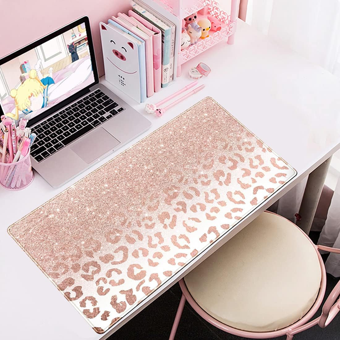 Large pink rose gold leopard print desk mat with stitched edges, non-slip bottom, ideal for office and gaming setups.