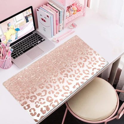 Large pink rose gold leopard print desk mat with stitched edges, non-slip bottom, ideal for office and gaming setups.