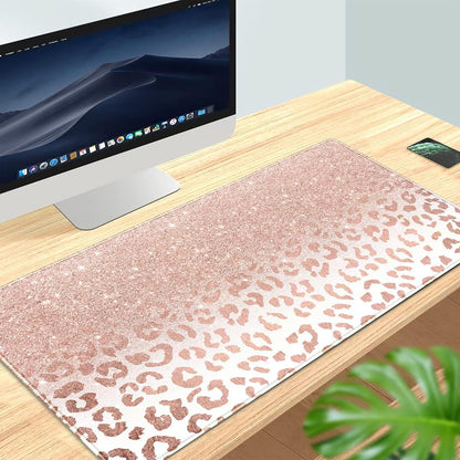 Large pink rose gold leopard print desk mat with stitched edges, non-slip bottom, ideal as a stylish office mouse pad for women.