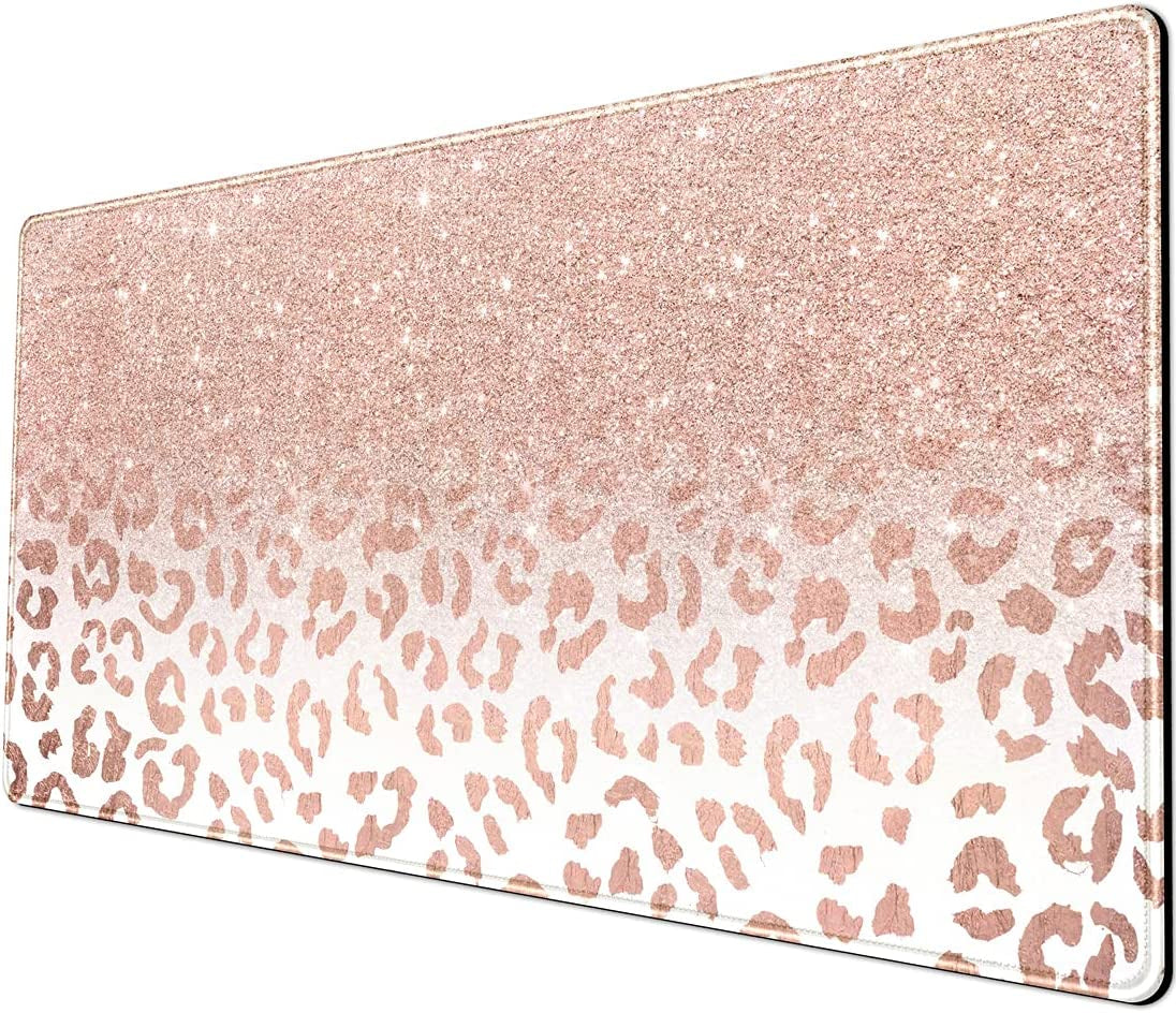 Large pink rose gold leopard print desk mat with stitched edges, non-slip bottom, suitable for office or home computer setup.