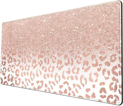 Large pink rose gold leopard print desk mat with stitched edges, non-slip bottom, suitable for office or home computer setup.