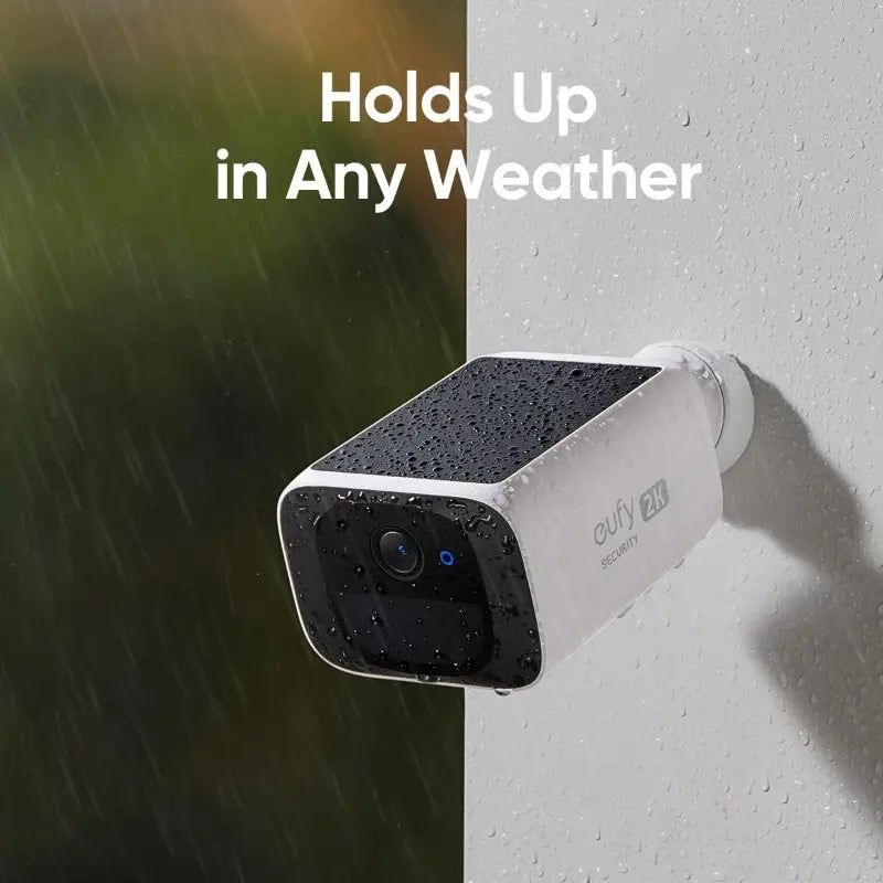Wireless 2K outdoor solar security camera by Tech Stop mounted on a wall with a lens and solar panel for outdoor surveillance.