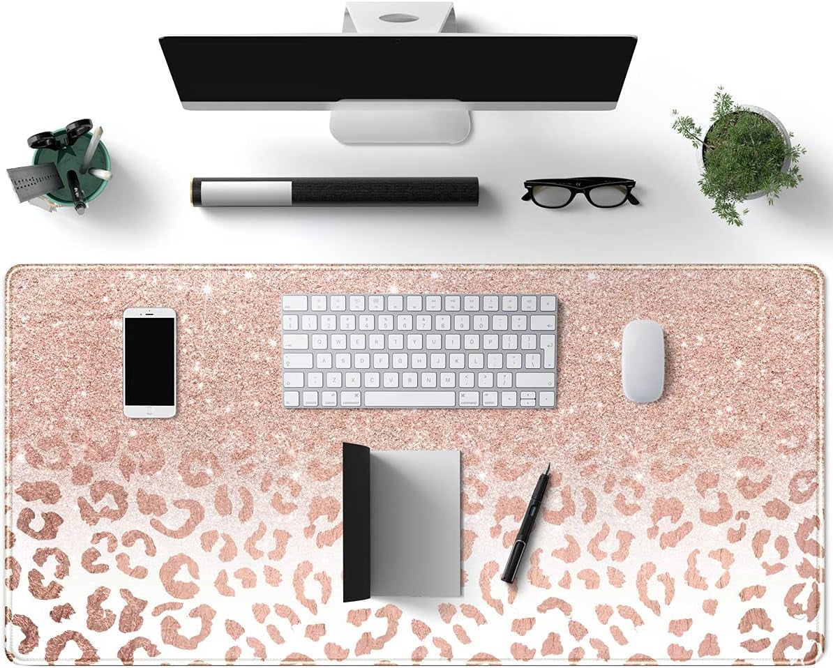 Large pink rose gold leopard print desk mat with stitched edges, non-slip bottom, ideal for office workspace and computer accessories.