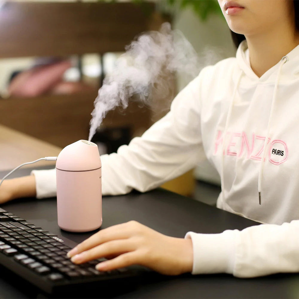 Tech stop AromaDrive 300ml USB diffuser emitting a gentle mist with fresh vibes, compact and portable for any space.